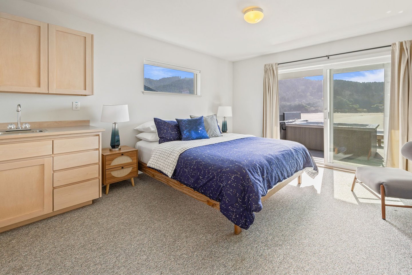 Downstairs is a Queen bed with ocean view.