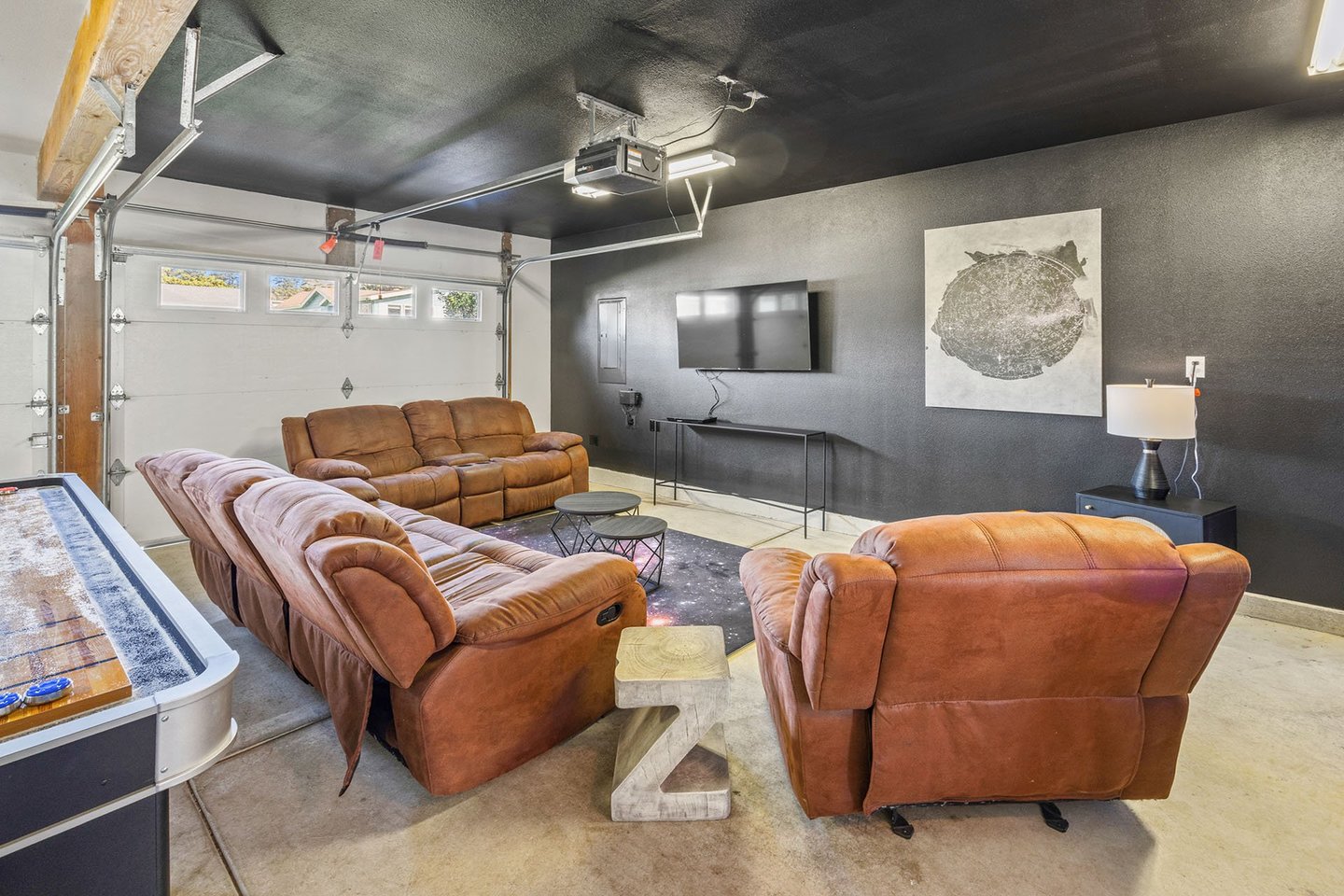 The game room in the garage has a TV and multiple games!