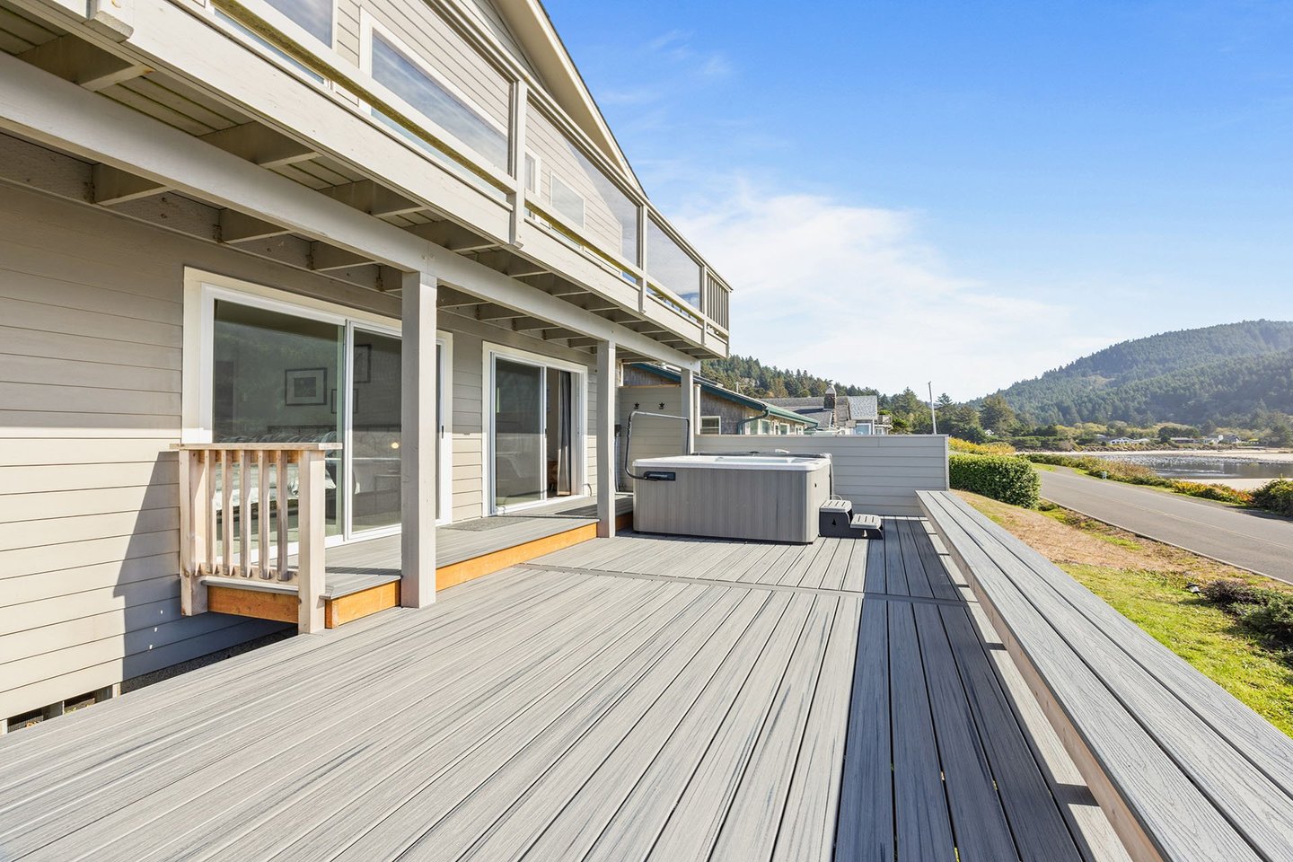 Large ocean front deck with hot tub.