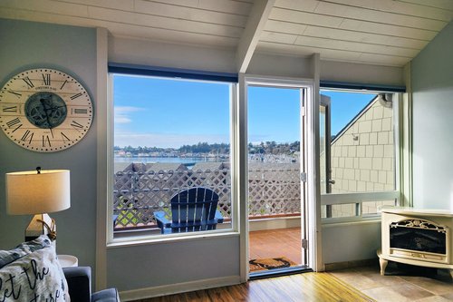 Step out on the private deck and enjoy watching the active harbor.