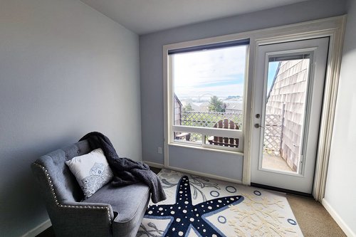 The sitting area in the primary suite is a perfect spot to relax with a good book.