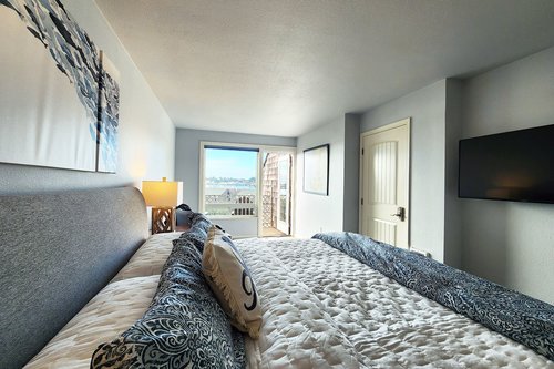 Comfy king bed and private deck await!