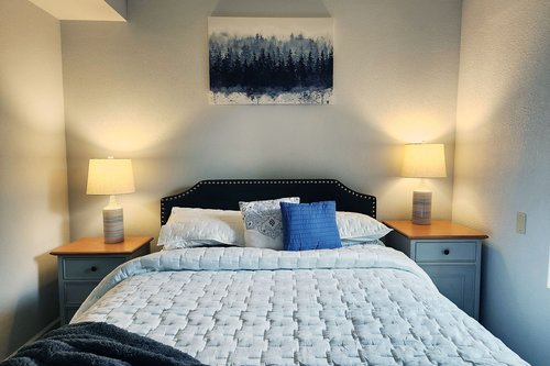 The second bedroom has a comfy queen bed.