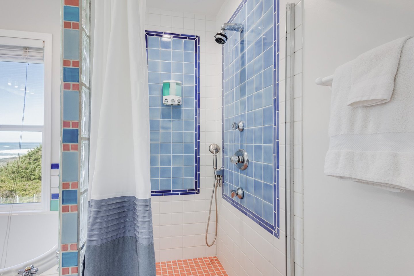 Tiled walk in shower.