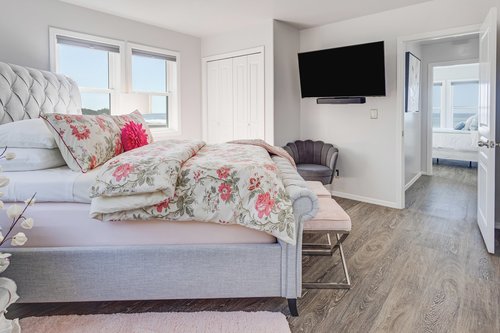Another bedroom upstairs has a comfy queen bed and ensuite bath.