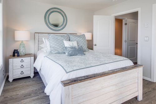 Cozy up in this queen bed in the third bedroom upstairs.