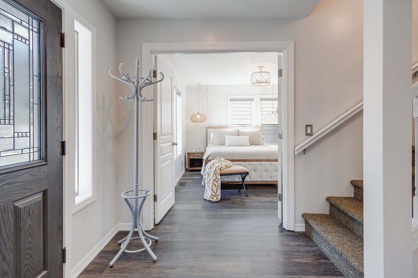 Main floor entry and one of 6 bedrooms.
