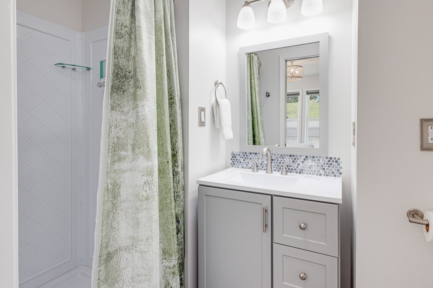 Ensuite bath with bedroom two has a walk in shower.