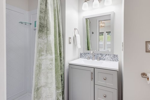 Ensuite bath with bedroom two has a walk in shower.
