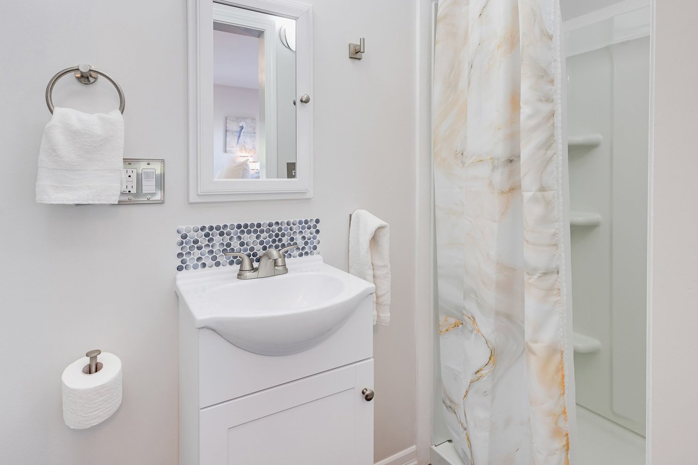 Ensuite bath with bedroom one has a walk in shower.