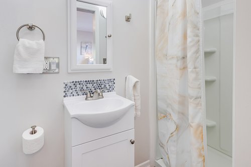 Ensuite bath with bedroom one has a walk in shower.