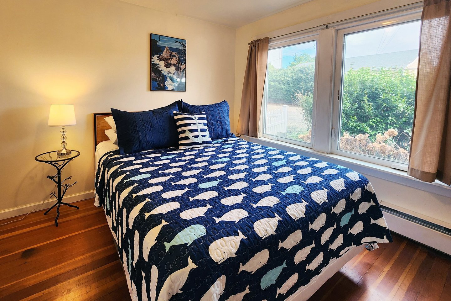Main floor bedroom with a cozy queen bed.