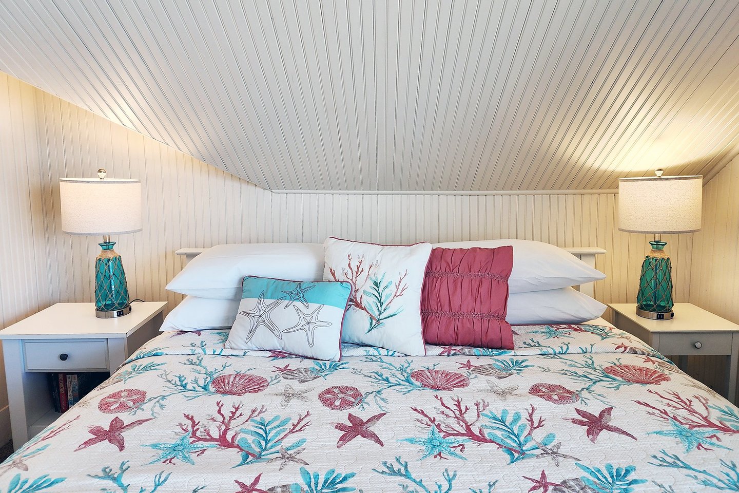King bed in the upstairs bedroom with view.