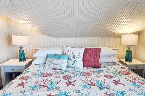 King bed in the upstairs bedroom with view.