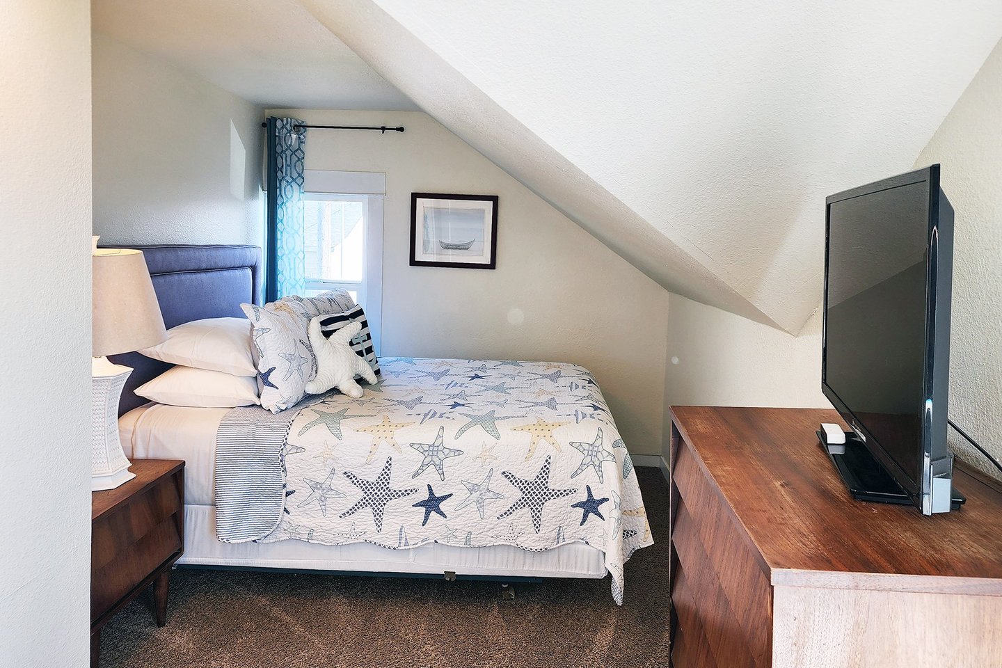 The Second bedroom upstairs boasts a queen bed.
