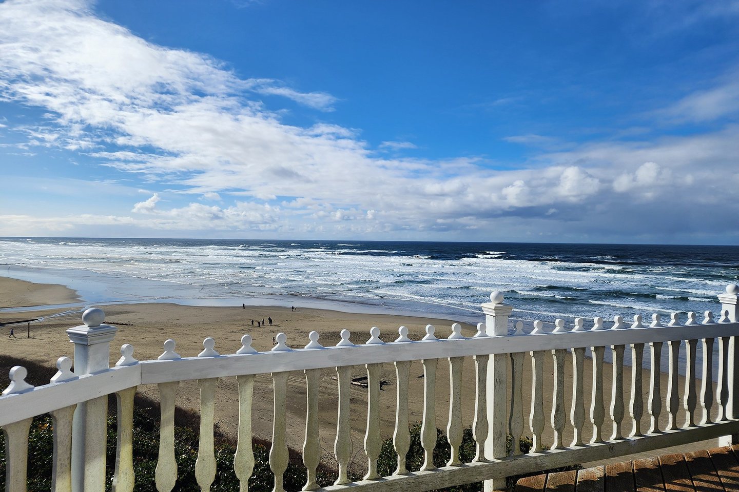 Wathc the waves and the people who are beachcoming from your perch on the deck.