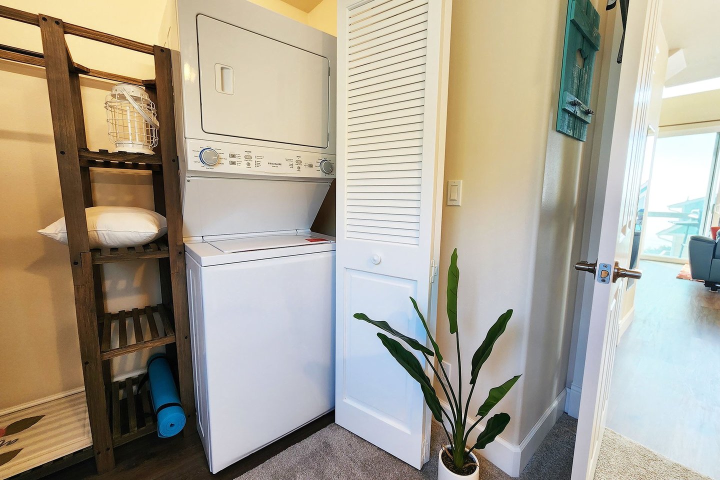 Stacked washer/dryer in the home for your convenience.