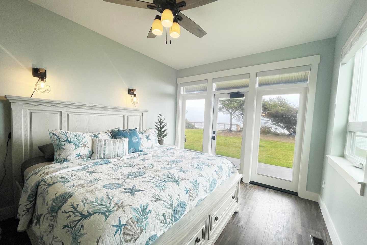 Ground floor bedroom, ensuite bath and King bed with access to the patio.