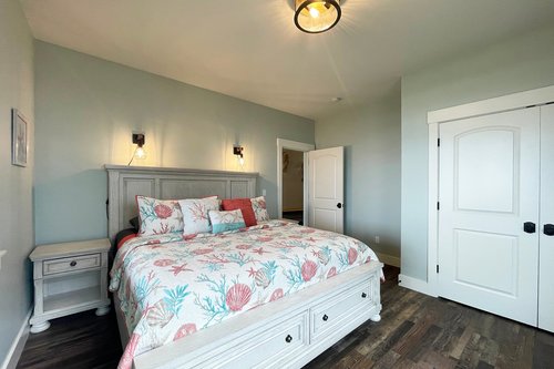 Bedroom four on the ground floor with king bed.