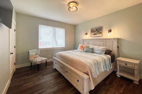 Bedroom five on the ground floor with king bed.