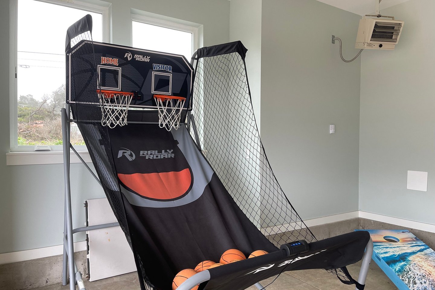 A fun basketball game is available in the garage.