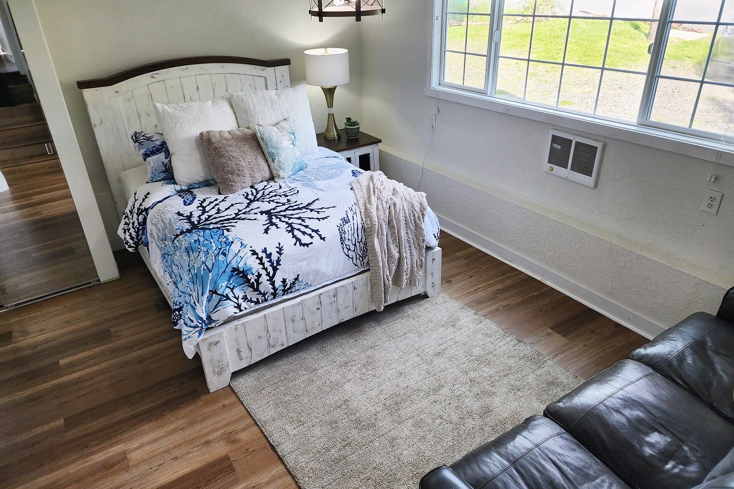 Down a few steps to the primary bedroom with ensuite bath.
