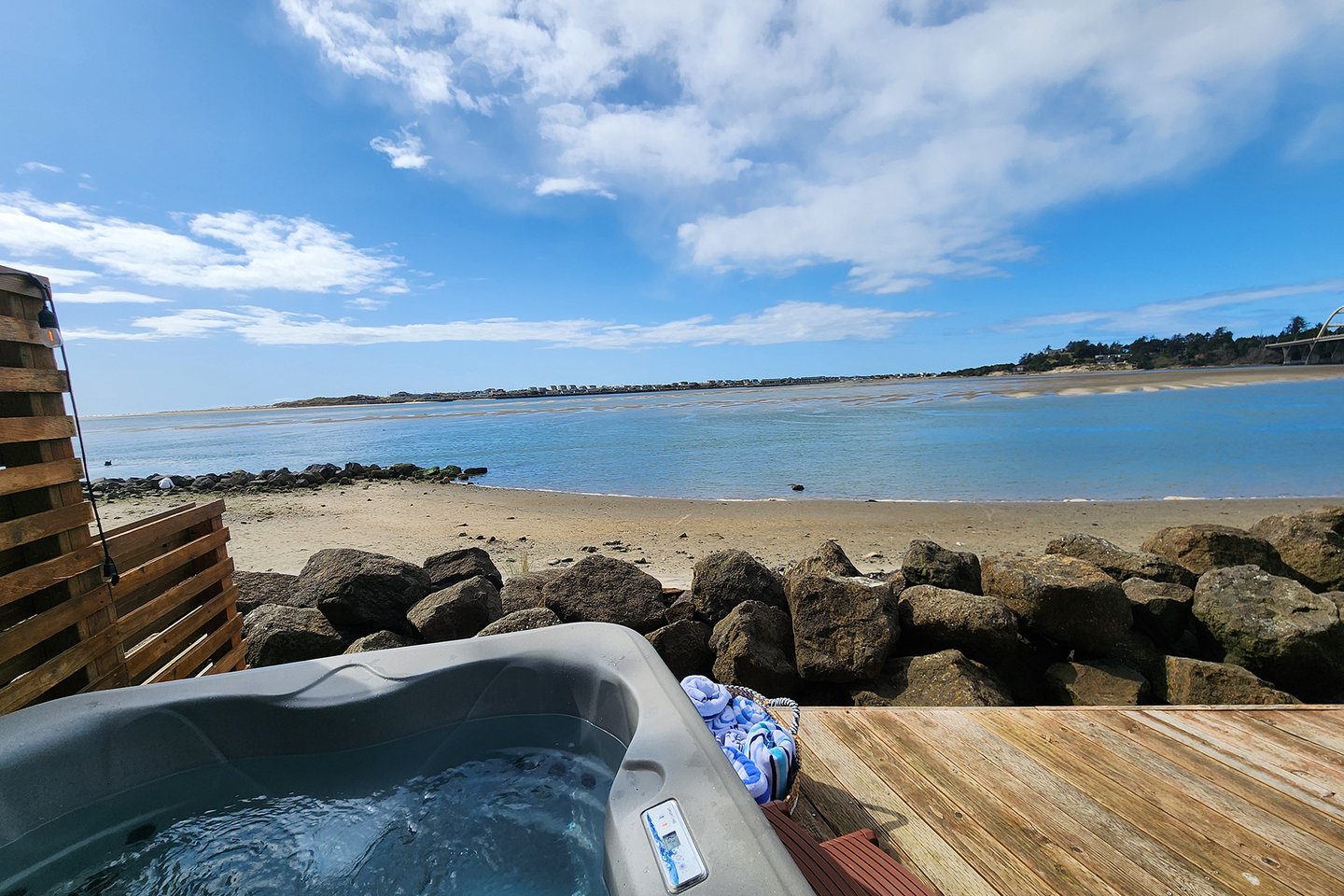 Soak in the hot tub while gazing at the soothing tides from the main house.