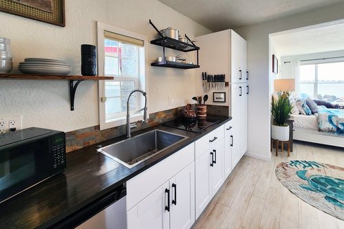 Studio: Lovely kitchen with farm sink, glass cook top and mini fridge.