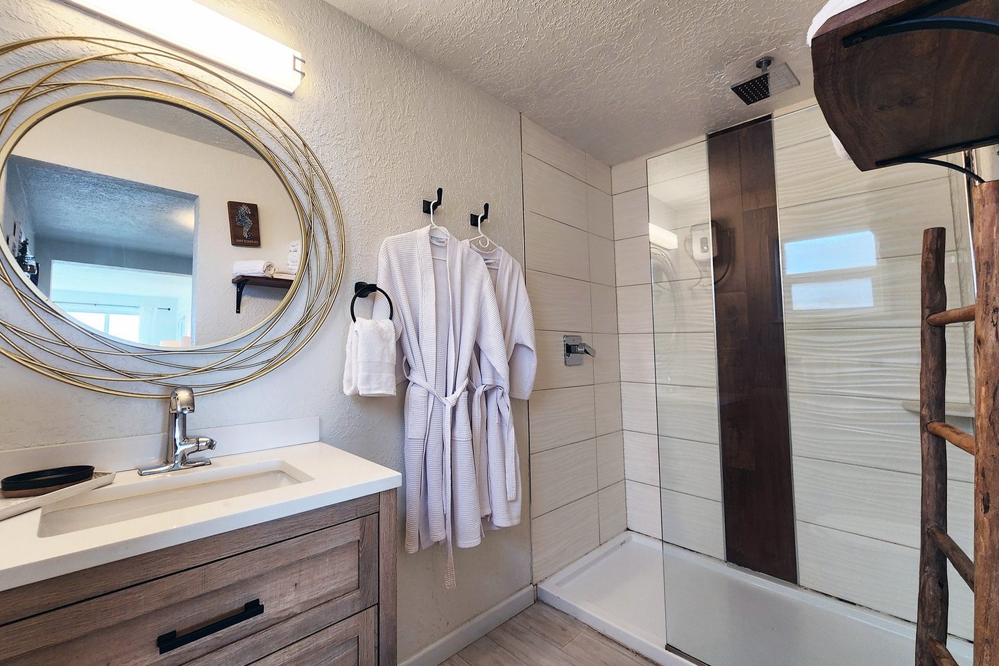 Studio: Spacious bath with walk in tiled shower.