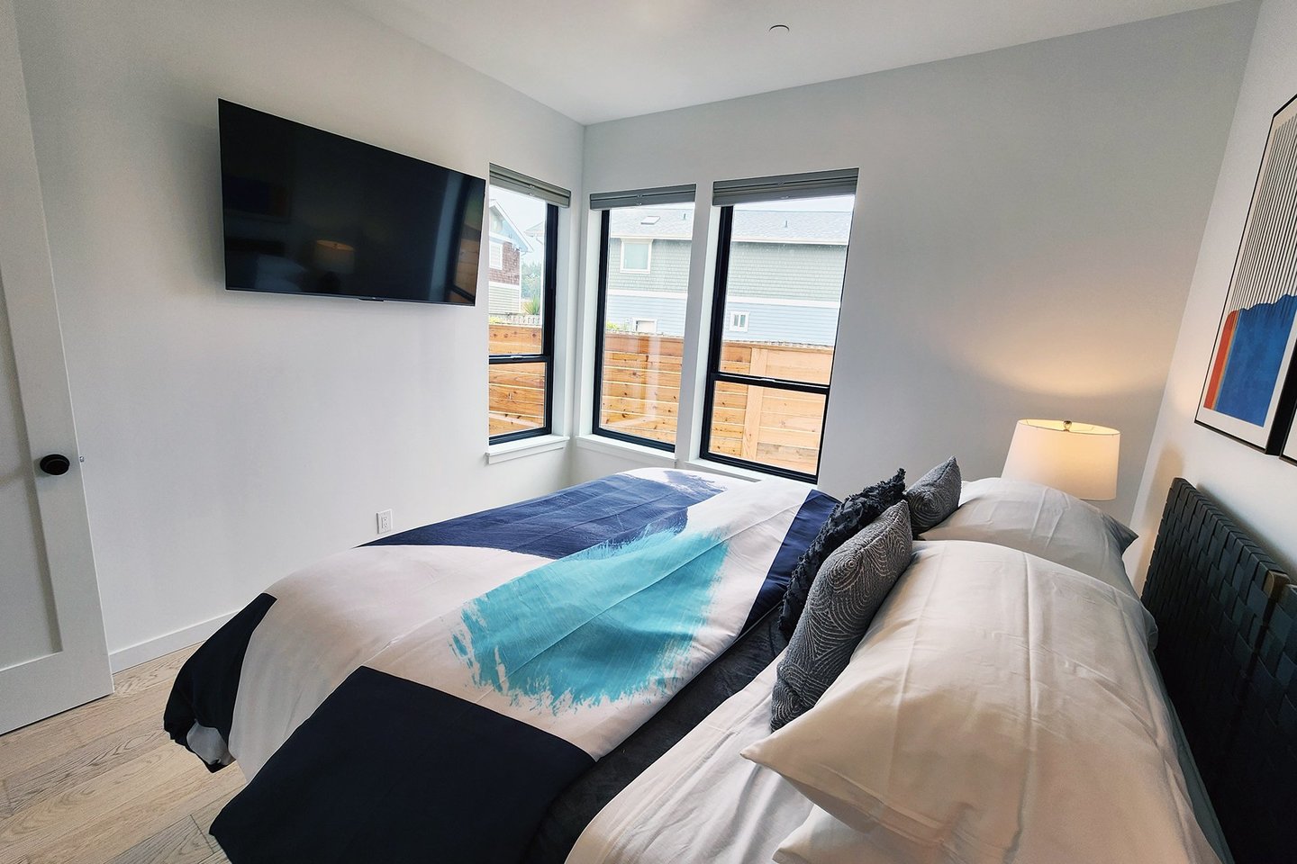 Entry level bedroom shares bath with den/office.