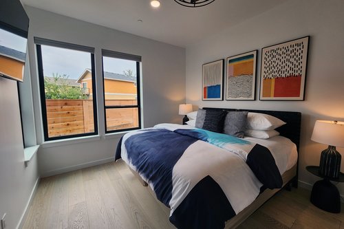 Bedroom #5 on the entry level floor with king bed that can be split into two twins.