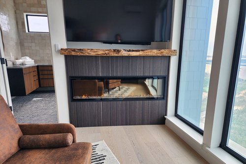 Large television and electric fireplace creates a wonderful ambiance.