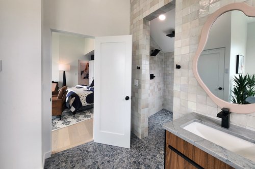 Walk in tiled shower in the ensuite bath.
