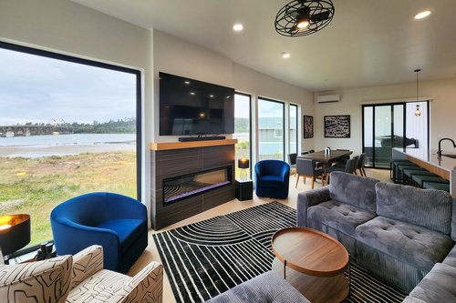 Sit back and relax with views, electric fireplace and large television.