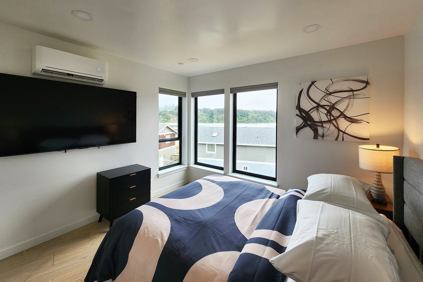 Third floor bedroom #2 with comfy queen bed and television.
