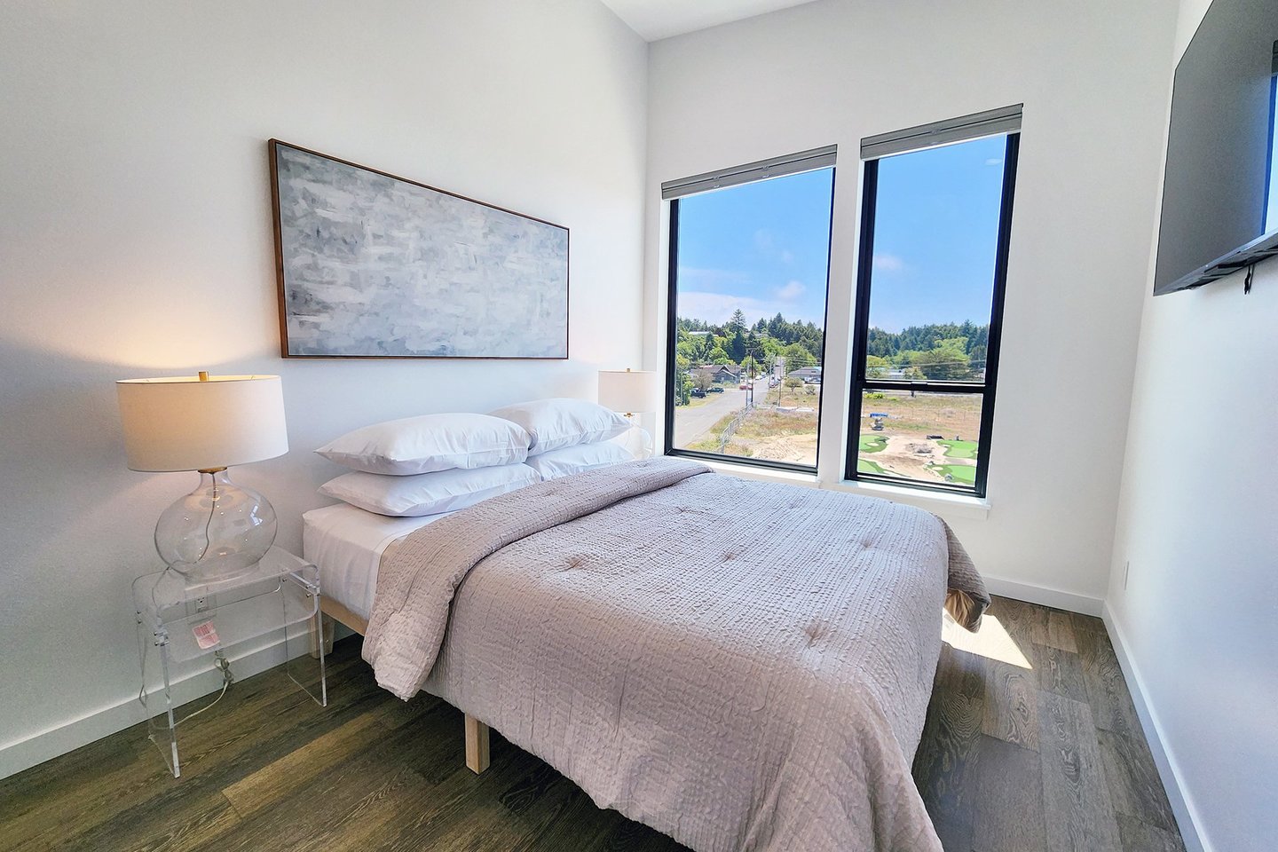 Second bedroom on the third floor is light and airy with a queen bed.