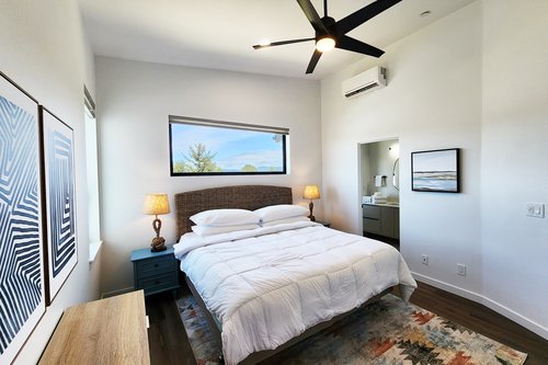 Primary bedroom on the third floor with king bed and ensuite bath.