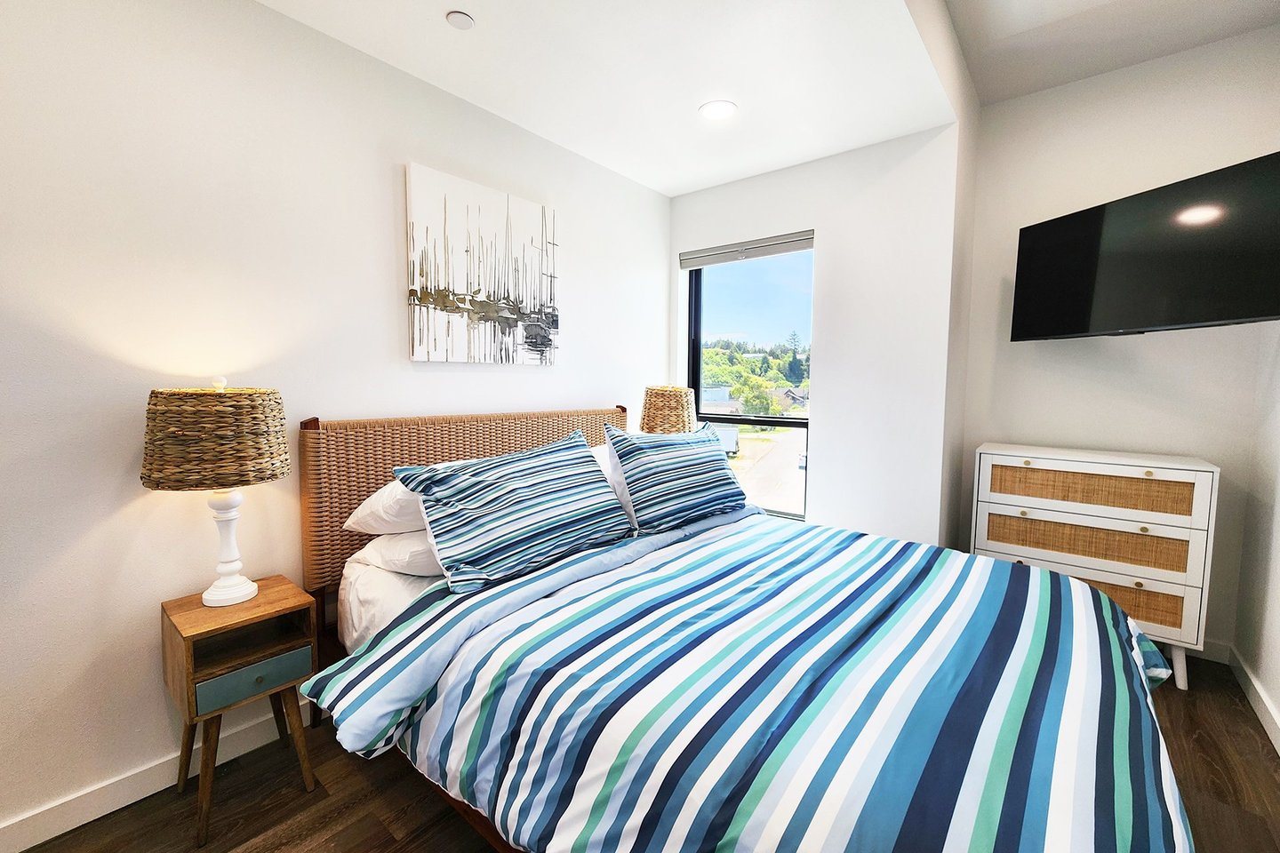 Second bedroom on the third floor with queen bed.