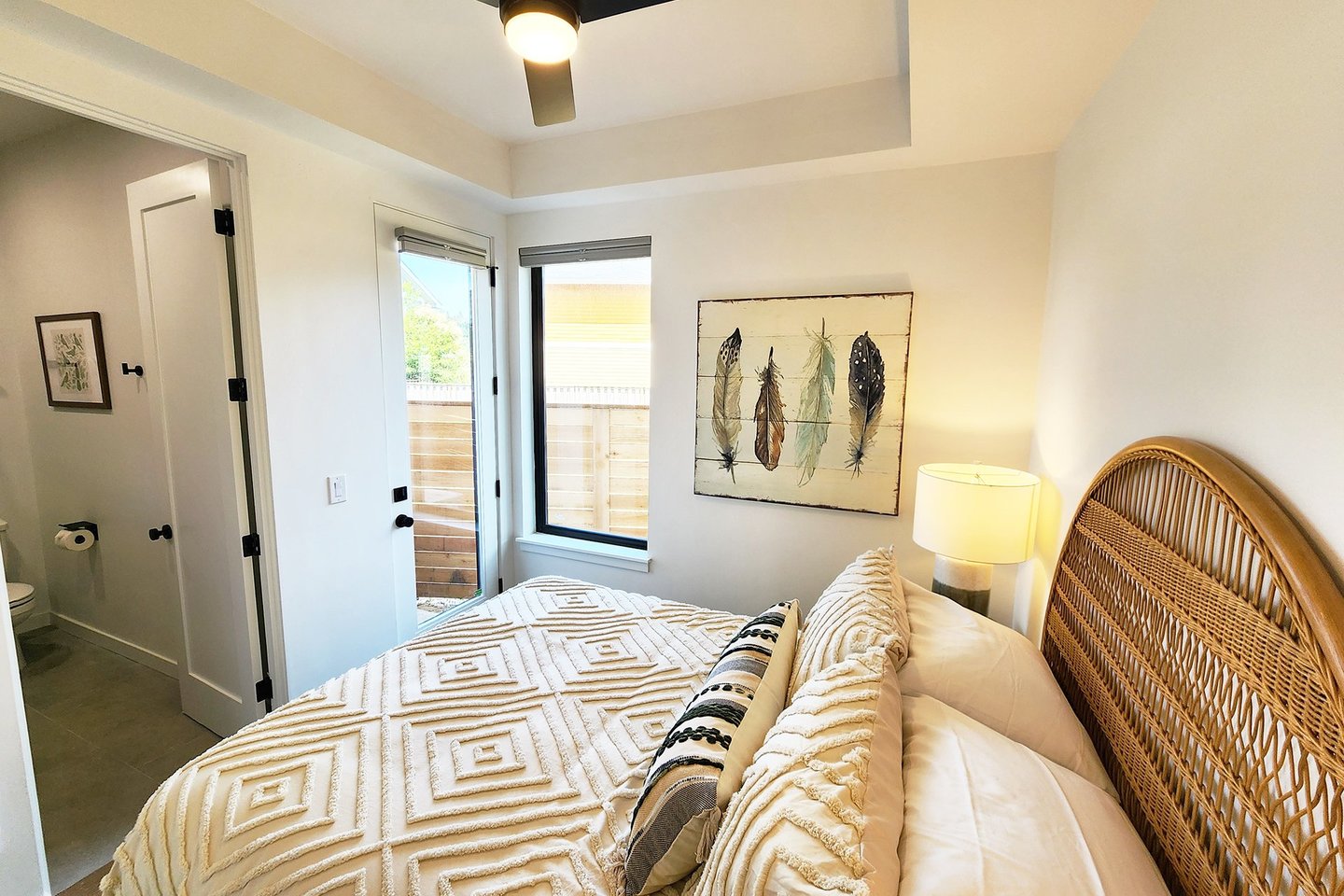 Entry level bedroom with queen bed, ensuite bath and access to the hot tub.