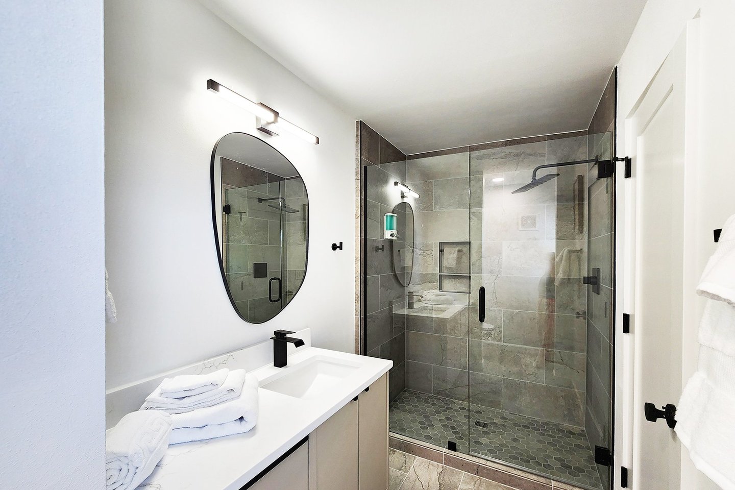 Primary bedroom ensuite bath with tiled walk in shower.