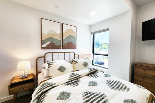 Third bedroom on the third floor with queen bed.