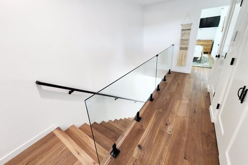 Stairs up to the third floor where 3 bedrooms are found.