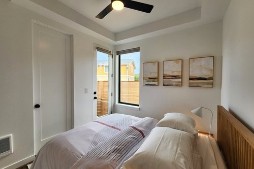 Entry level bedroom with queen bed has access to the hot tub.