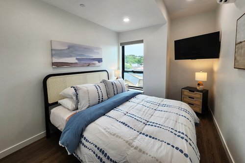 Third bedroom on the third floor with a queen bed.