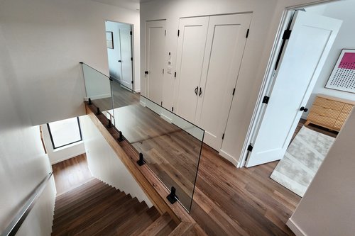 Stairs to the third floor. The hall has a washer/dryer in a closet.