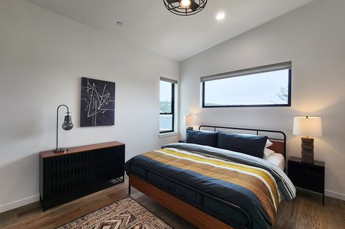 The Primary suite with comfy king bed on the third floor.