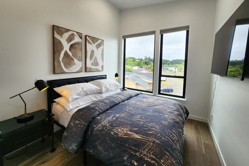 The 2nd bedroom on the third floor with a comfy queen bed