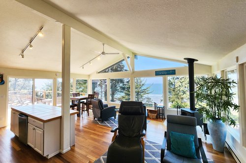 Open concept with walls of windows.