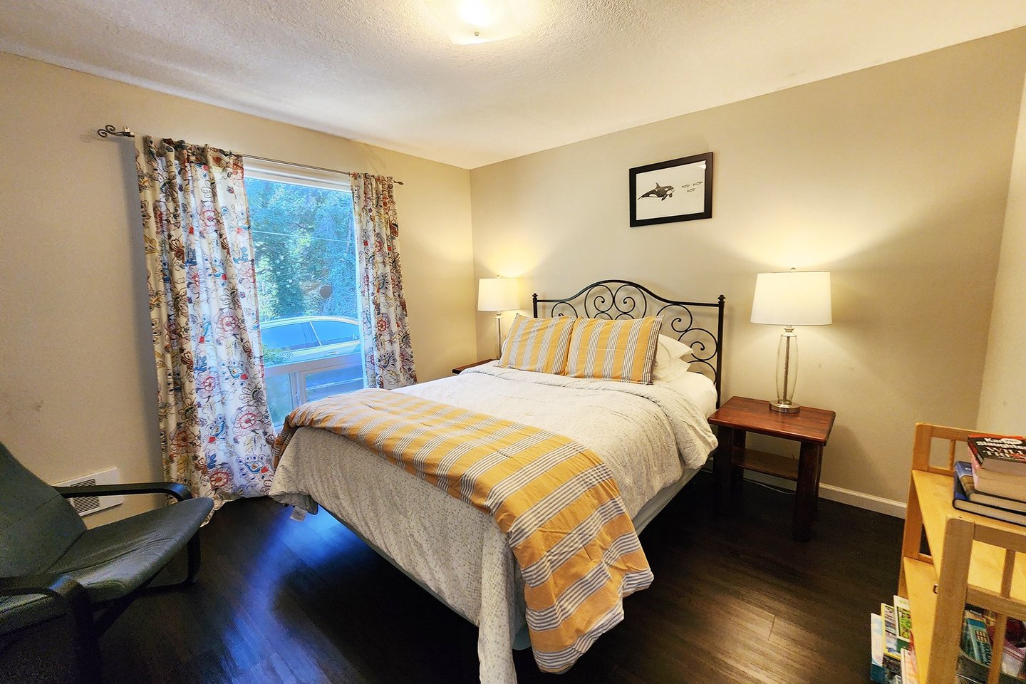 Cozy up in this queen bed in the second main floor bedroom.