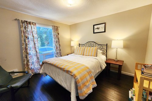 Cozy up in this queen bed in the second main floor bedroom.